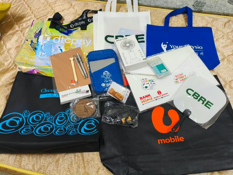 Goodies collected from companies at INTI industry events including dtcpay, CBRE, U Mobile, Public Bank, Cheng & Co Group and Your Physio