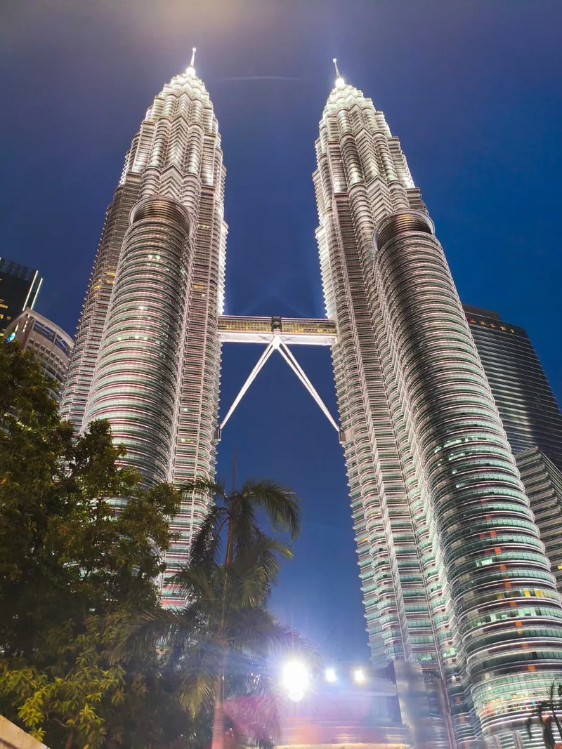 The Petronas Twin Towers in Kuala Lumpur lit up at night