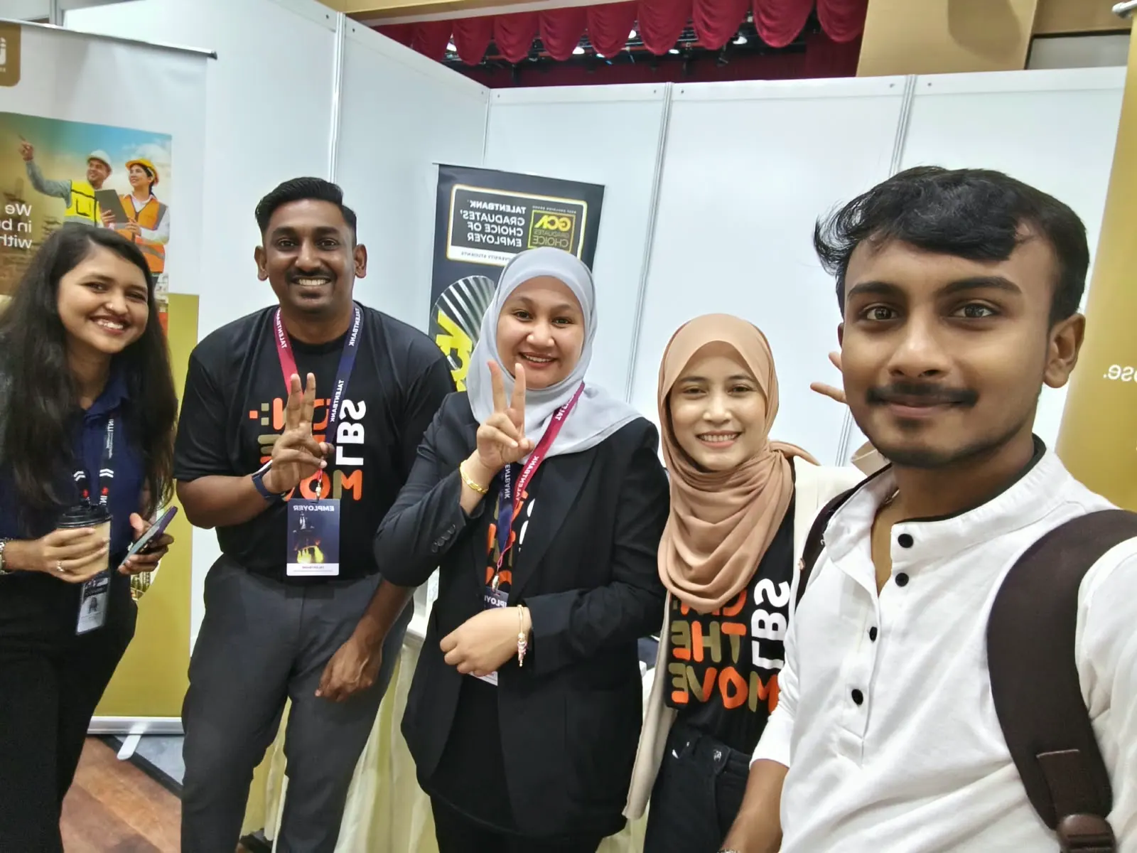 Prathamesh Halale with industry representatives at an employer booth during an event at INTI, Malaysia