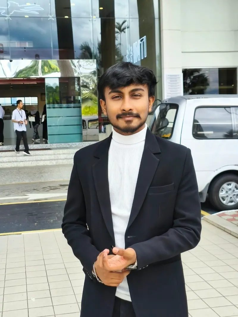 Prathamesh Halale at the INTI International University campus entrance in Malaysia