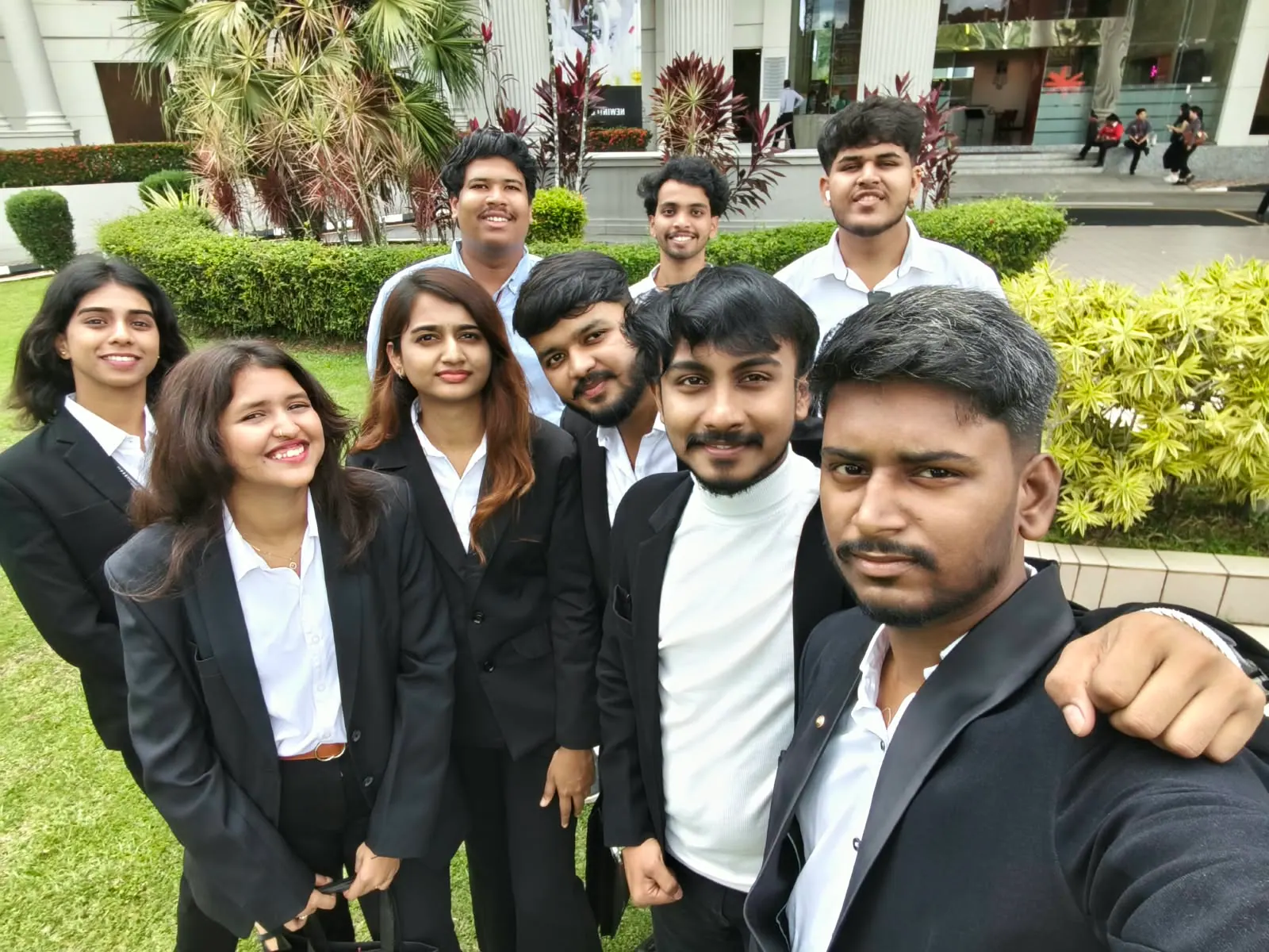 Prathamesh Halale with fellow international students in formal wear at INTI International University, Malaysia