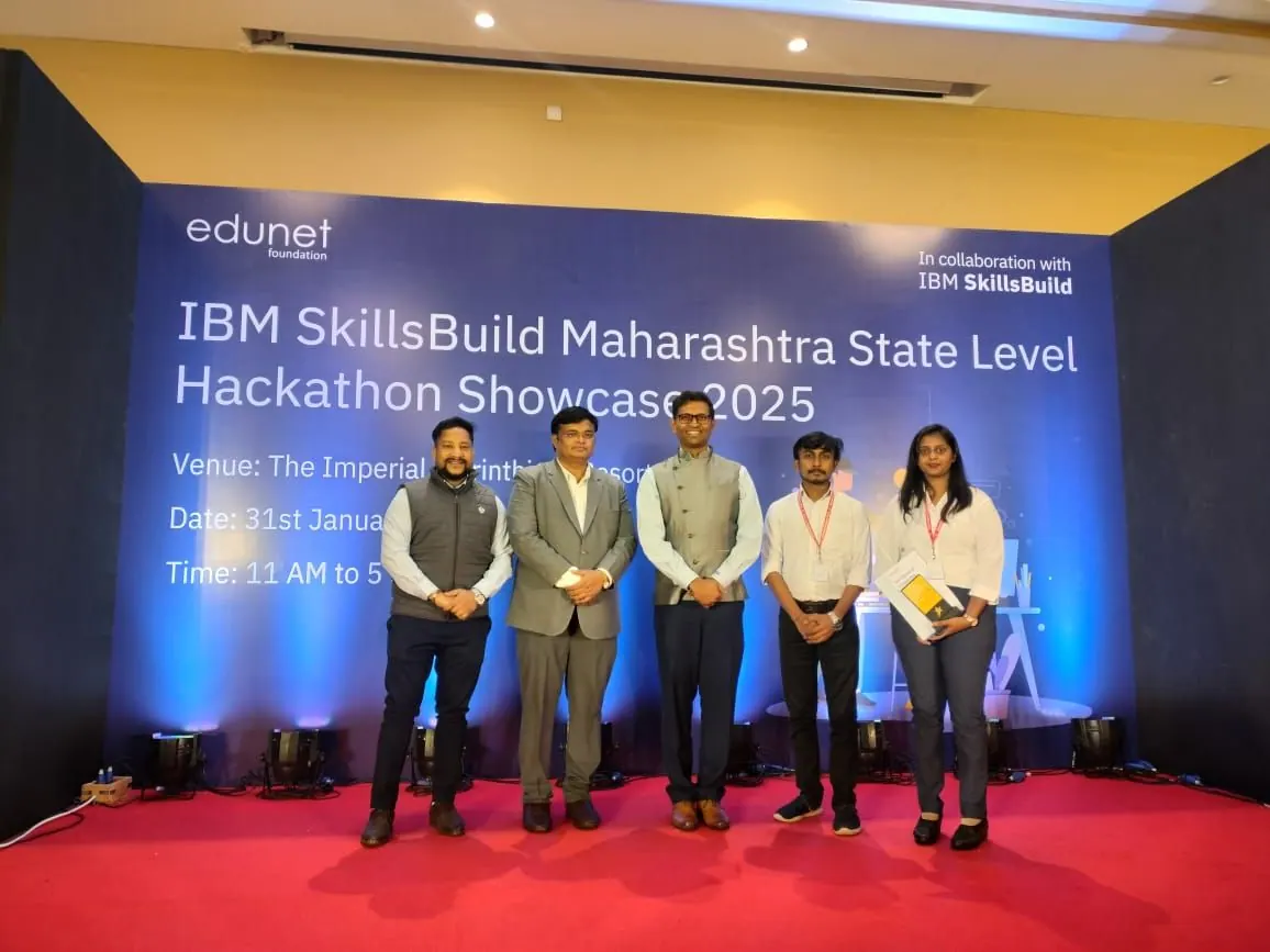 Prathamesh Halale on stage with the jury at the IBM SkillsBuild Maharashtra State Level Hackathon Showcase 2025 by Edunet Foundation