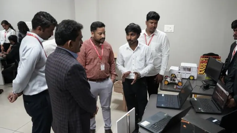 NextIn team presenting software and hardware prototypes to university leadership and industry guests at the Sanjay Ghodawat University Incubation Center