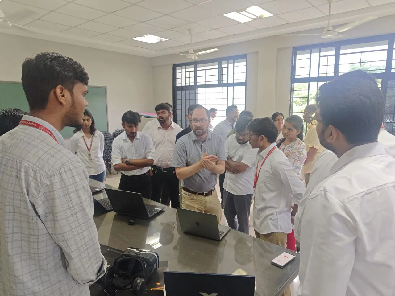 Discussion with David Curran about NextIn's technology, with laptops and a VR headset on the demo table