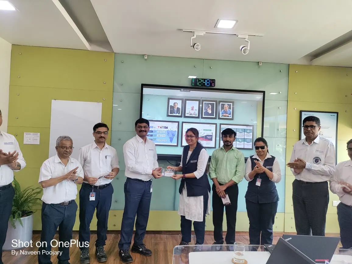 Prathamesh Halale with the Tata Motors team at an event in a conference room at Tata Motors, Dharwad